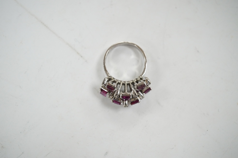 An 18k white metal, ruby and diamond cluster set cocktail ring, size K/L, gross weight 5.7 grams. Condition - fair to good